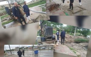 کارگران شهرداری شادگان مشغول رفع آبگرفتگی معابر هستند